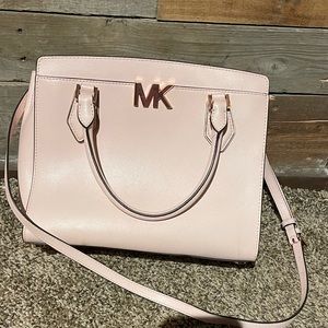 Michael Kors Mott powder blush leather medium messenger bag.